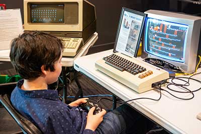Kid playing a retro video game