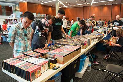 Event goers checking out gaming merchandise